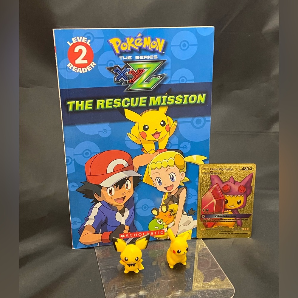 Pokémon book with Pikachu gold card and figurines